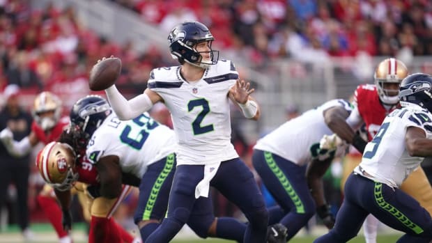 Drew Lock steps back to pass against the 49ers.